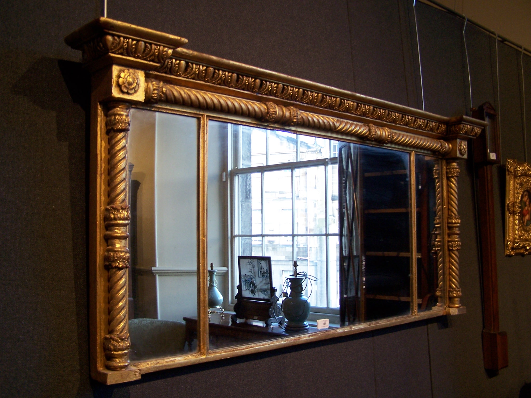 A giltwood triptych overmantel mirror