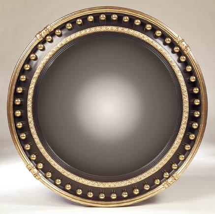 A large Regency style convex wall mirror,