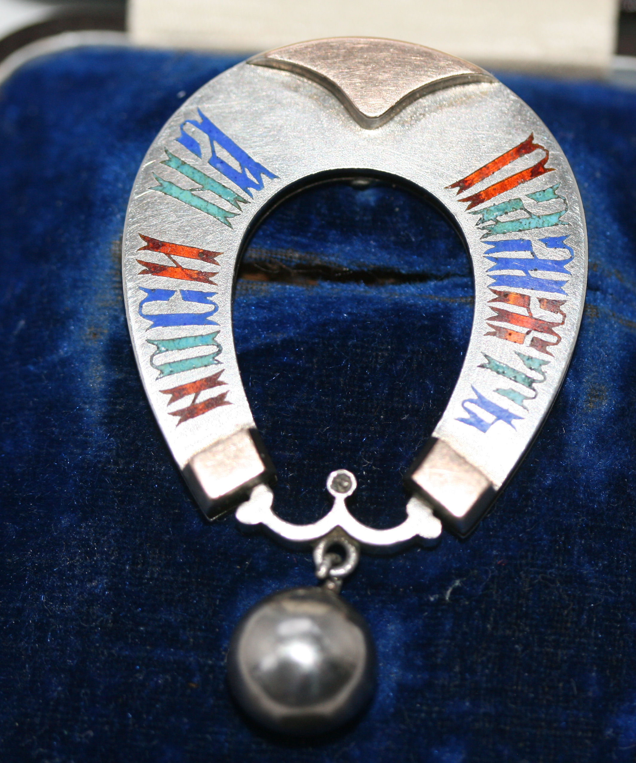 A Russian silver and enamel horseshoe