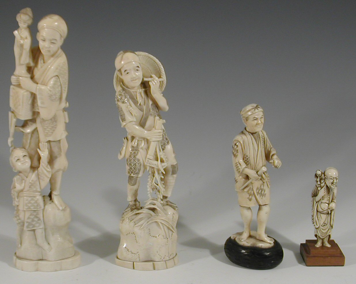 A late 19th century Japanese carved ivory figure group,