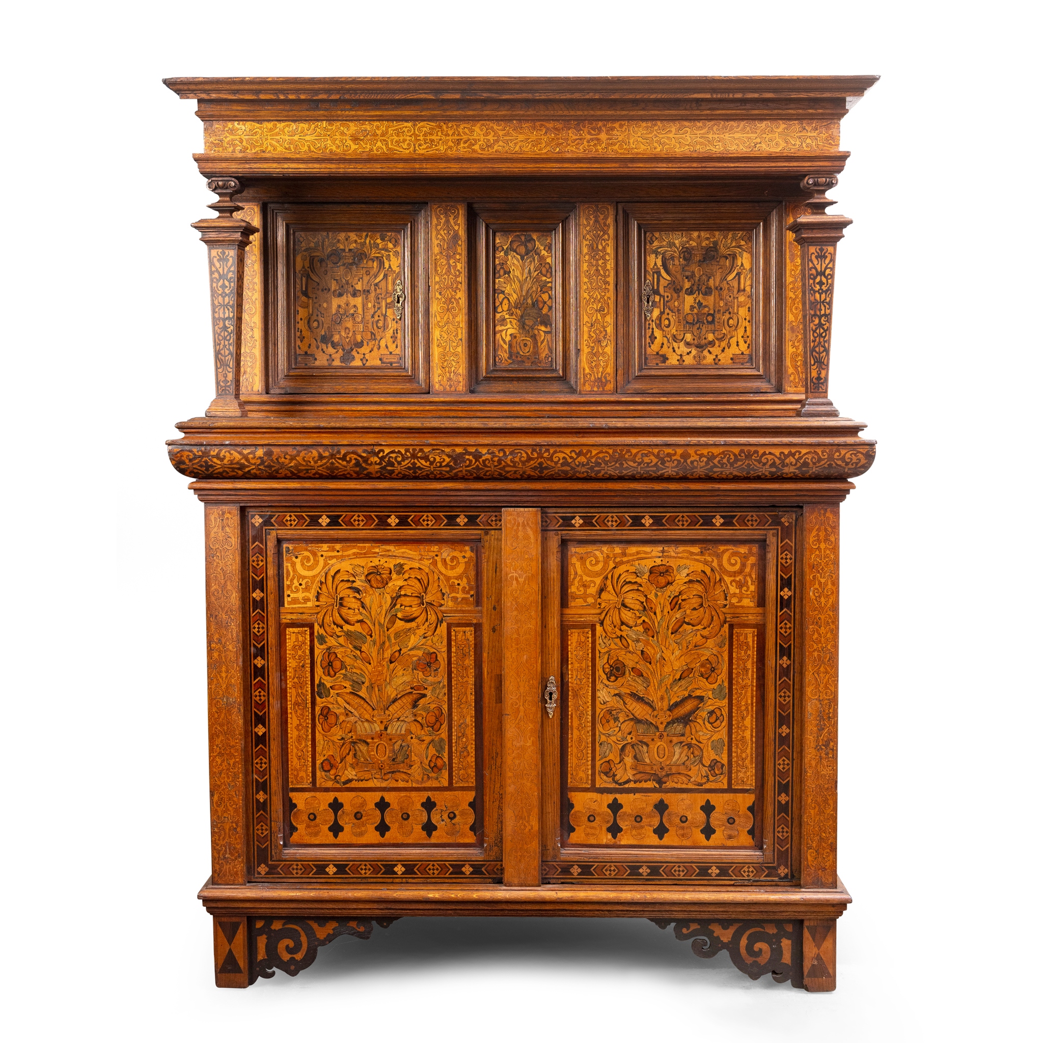 A CONTINENTAL OAK AND MARQUETRY INLAID DRESSER