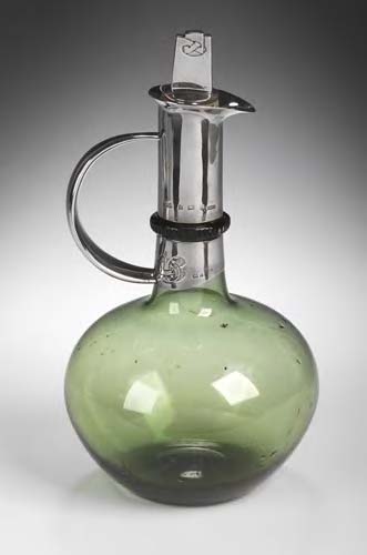 Archibald Knox (1864-1933) A rare Cymric silver-mounted decanter,