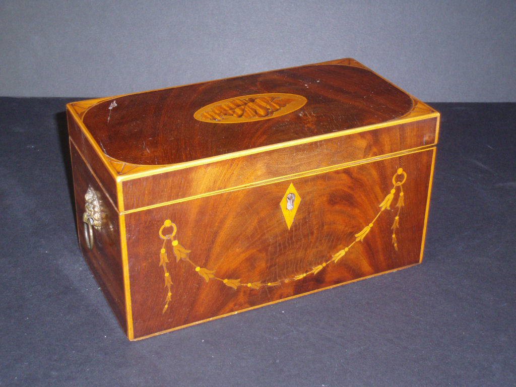 A Georgian style inlaid mahogany tea caddy