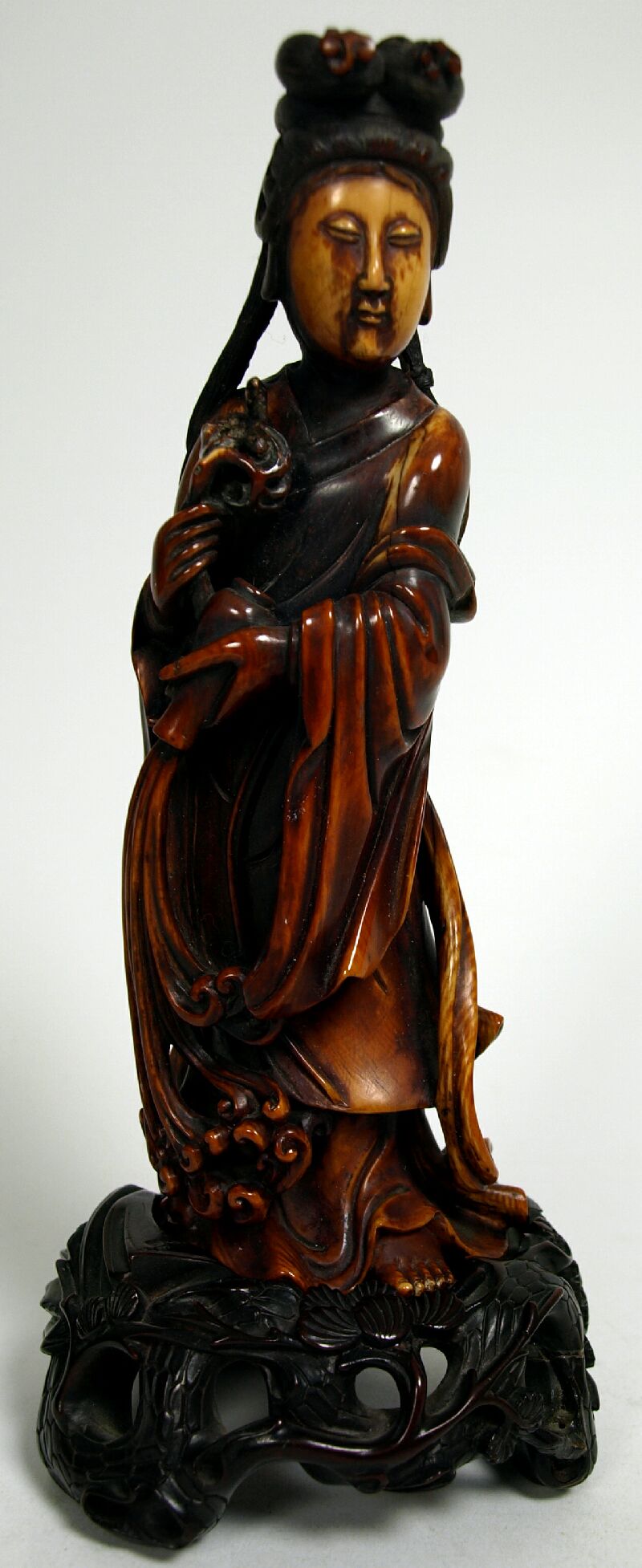 A 19th century Chinese stained ivory Guanyin figure