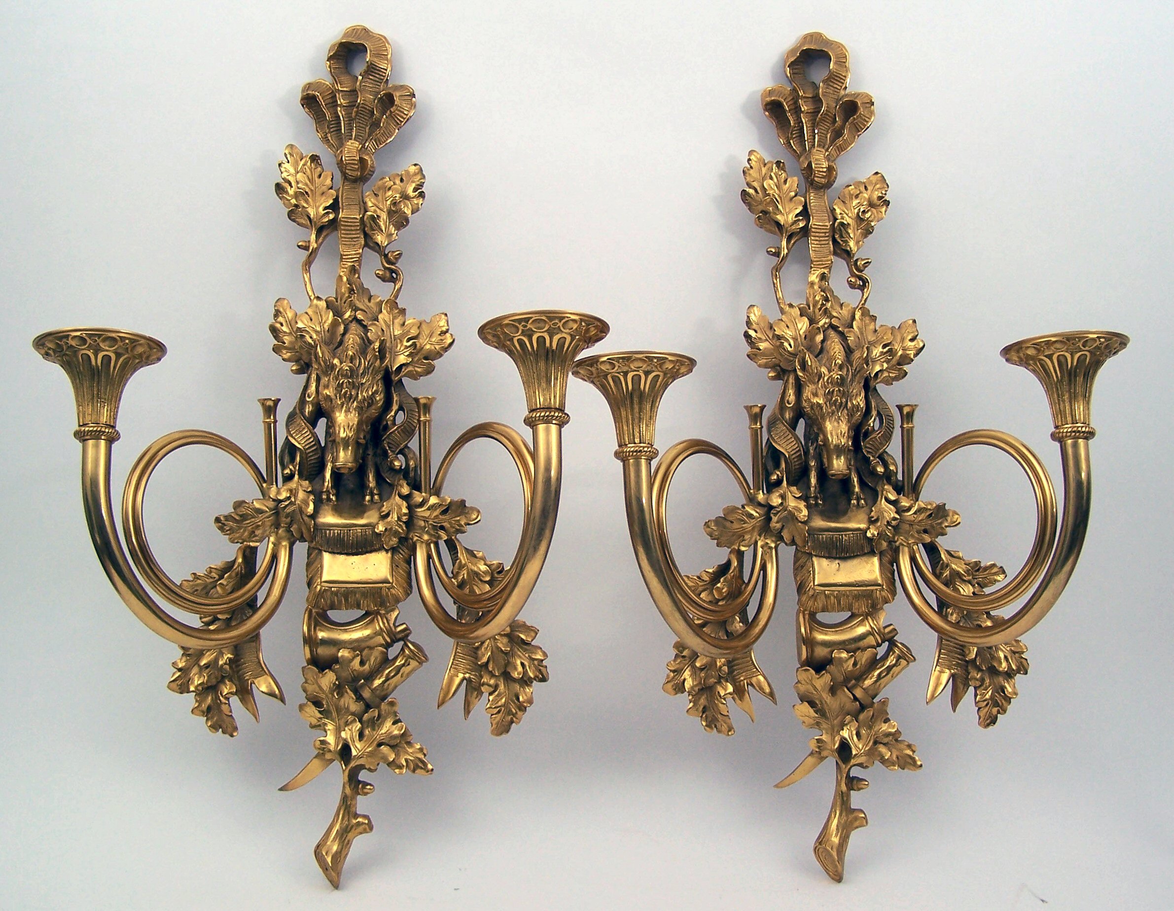 A pair of gilt brass two branch wall sconces,