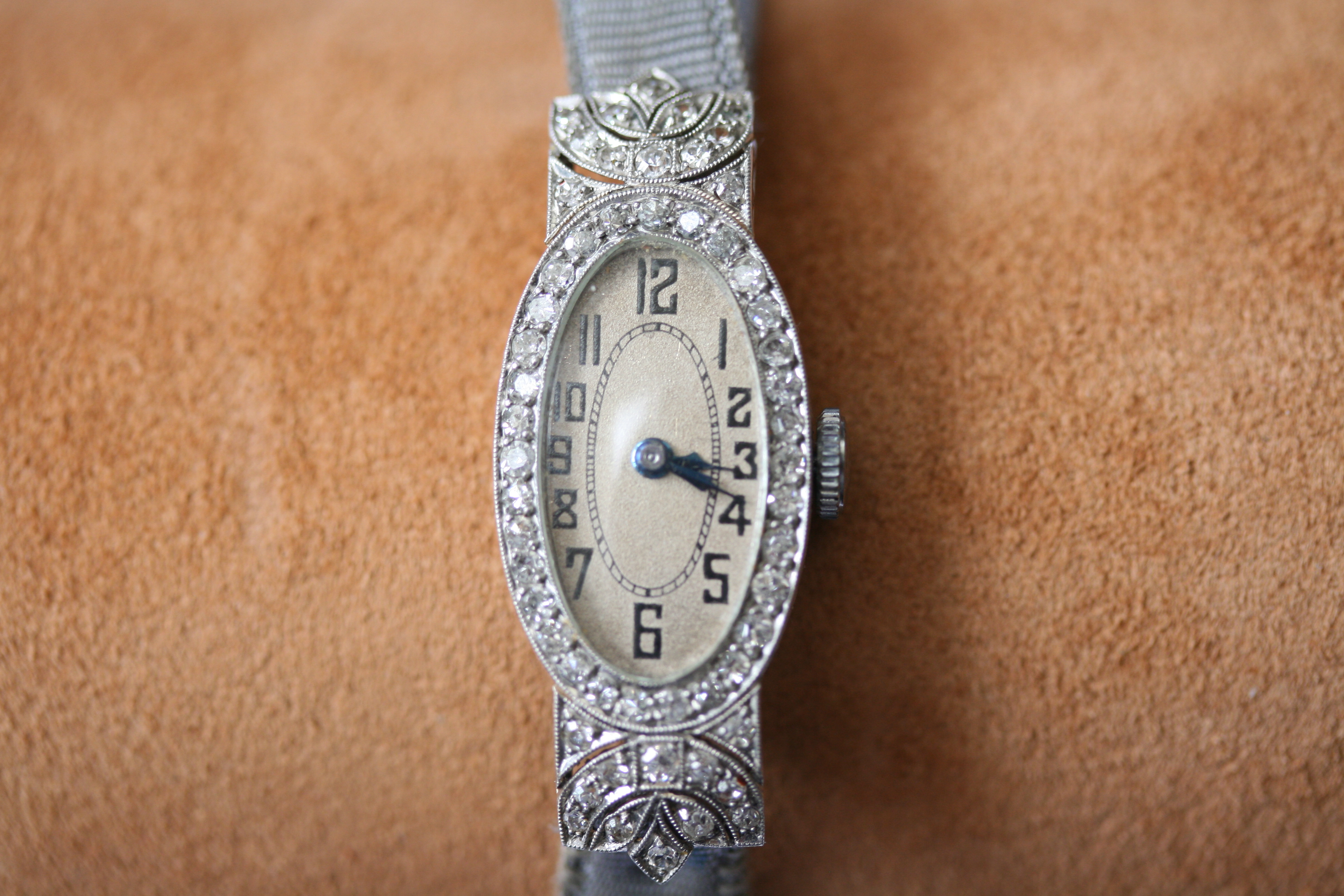 An Art Deco platinum and diamond cocktail watch