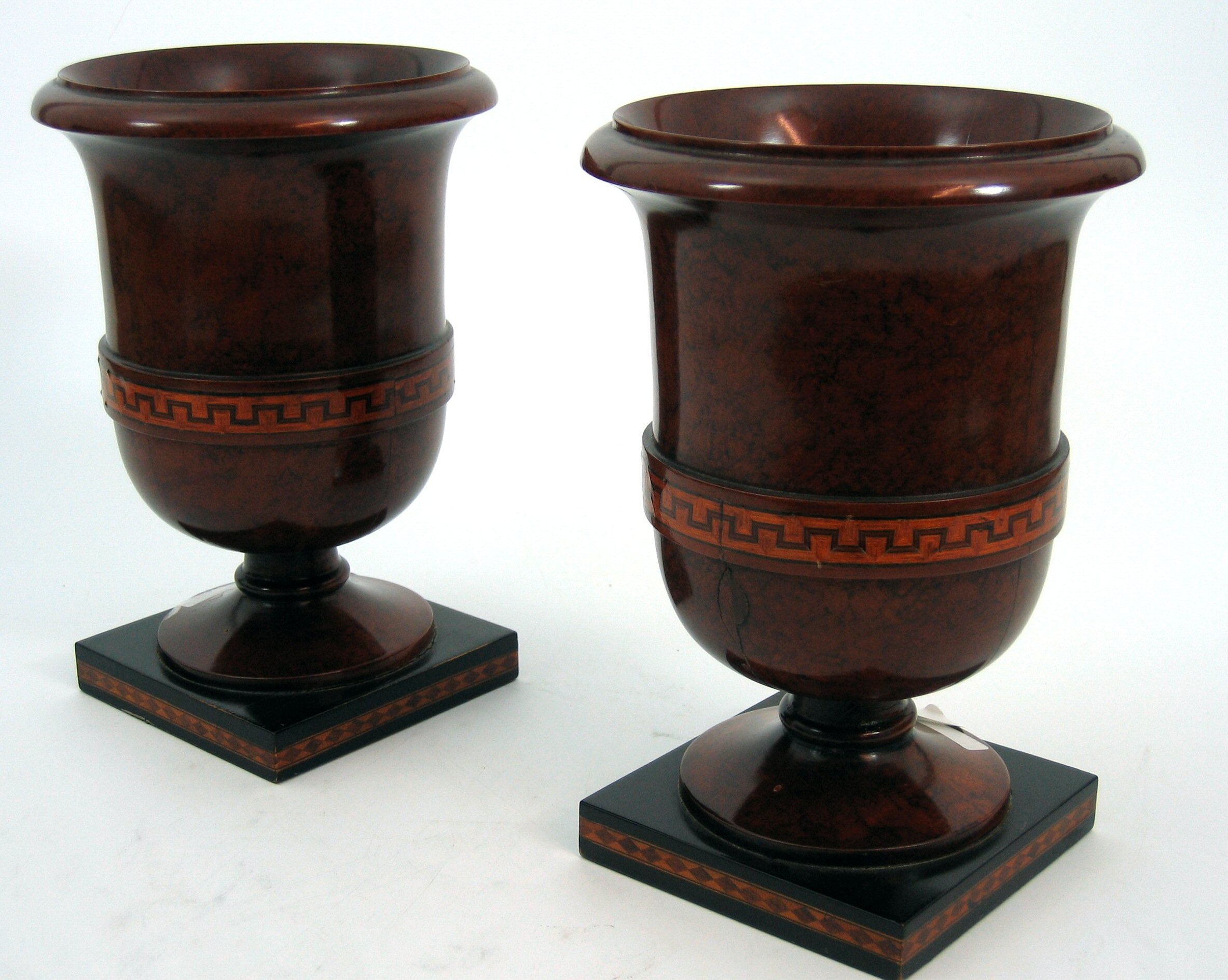 A pair of late Victorian figured walnut urns,