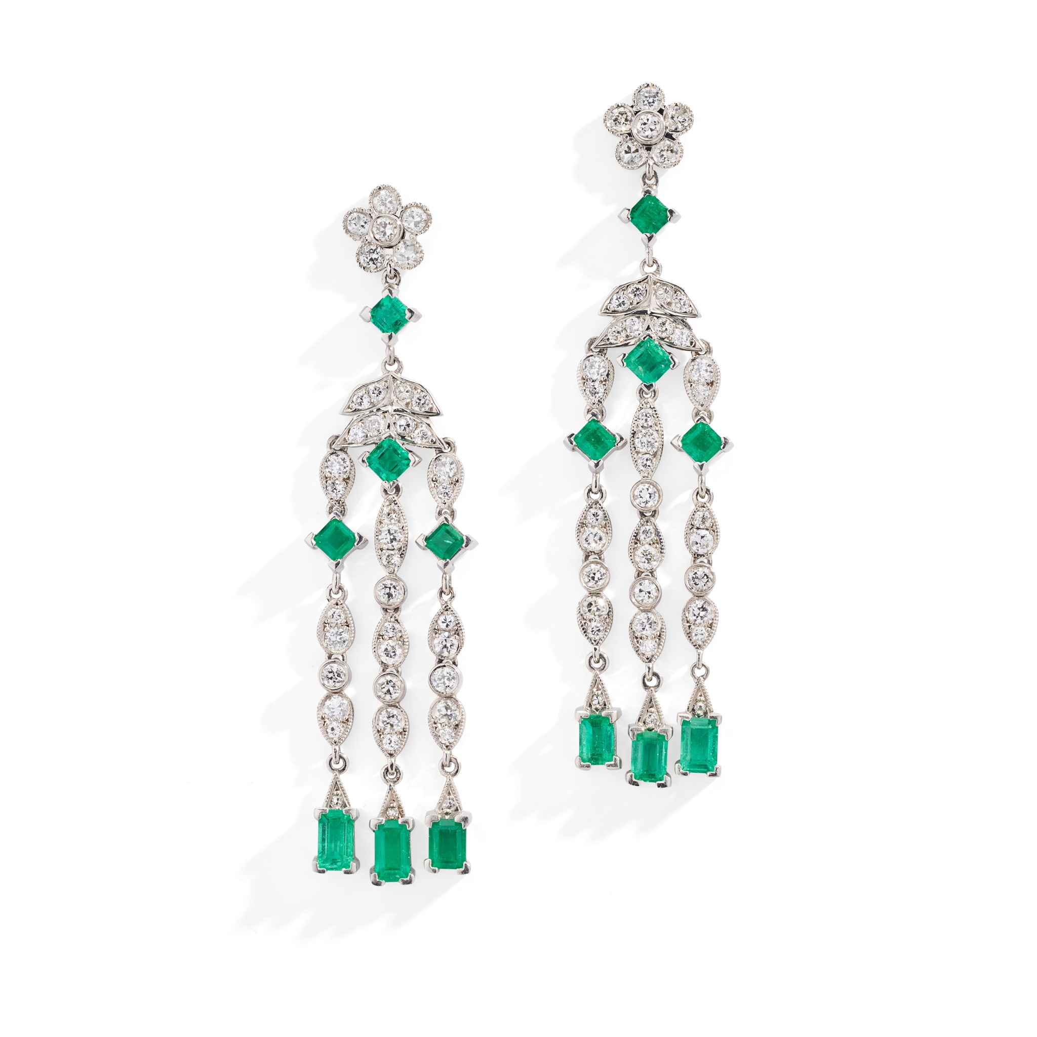 A pair of emerald and diamond pendent earrings