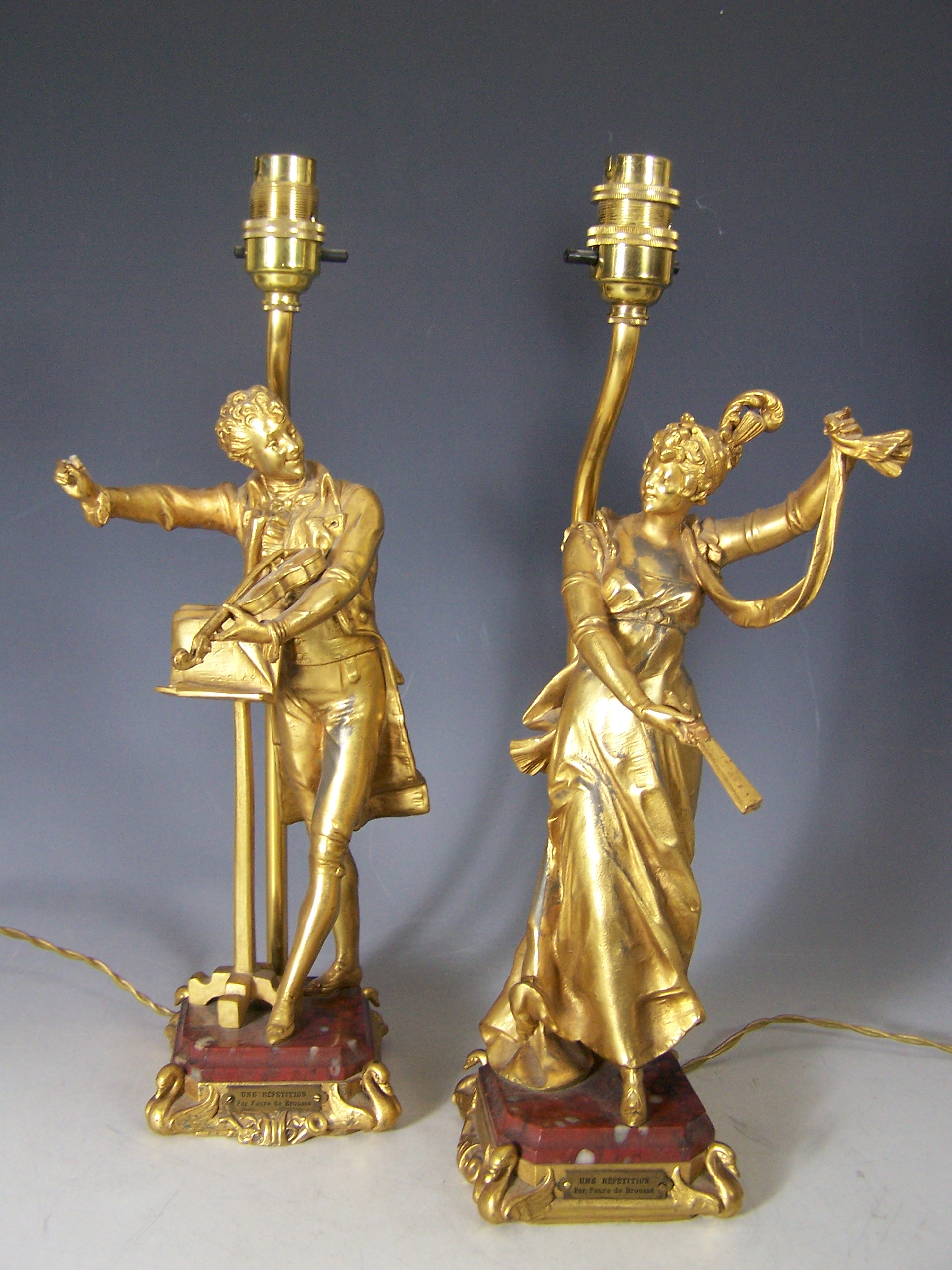 A pair of French gilt bronze lamps,