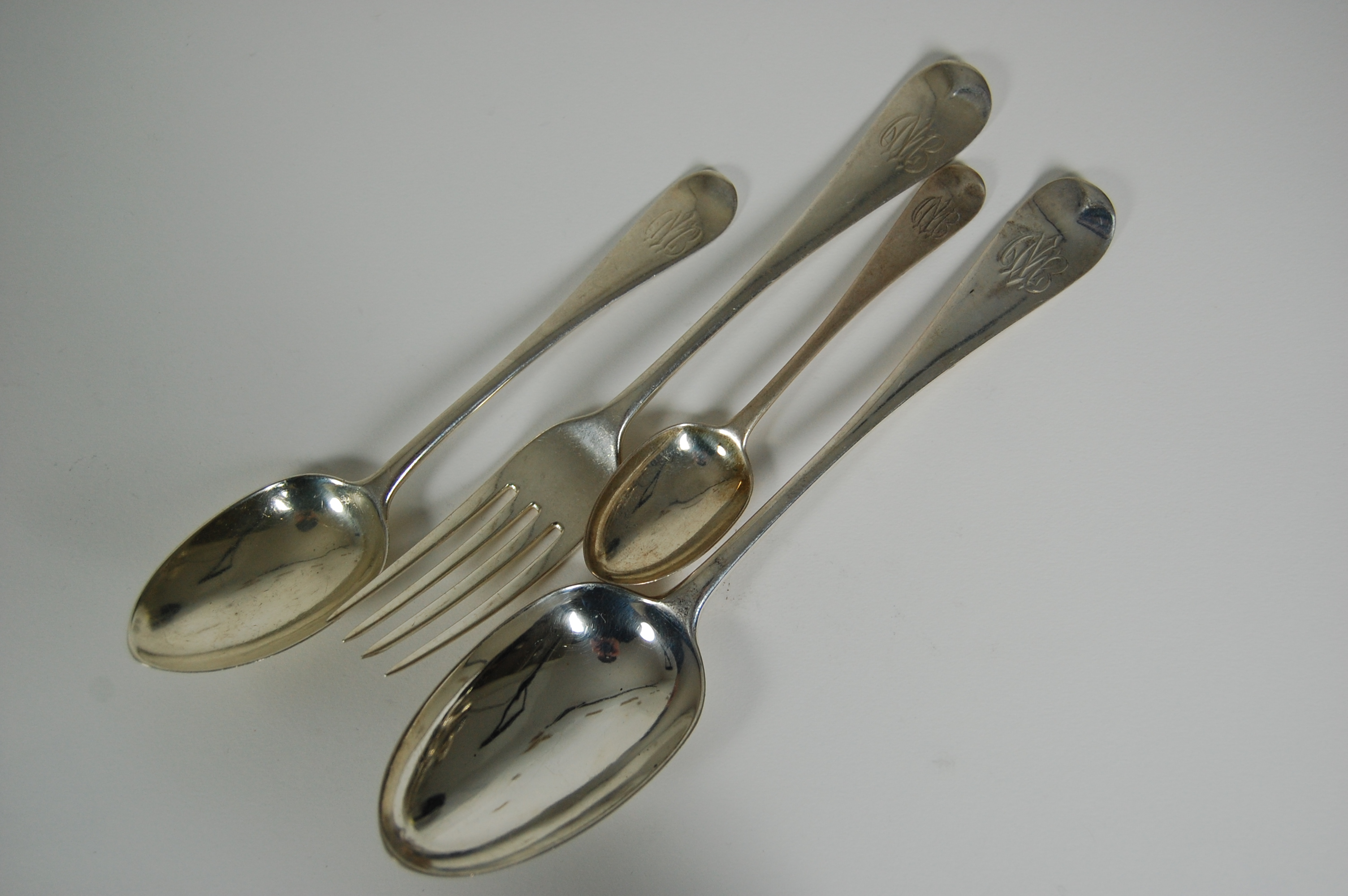 A matched set of Old English pattern silver flatware
