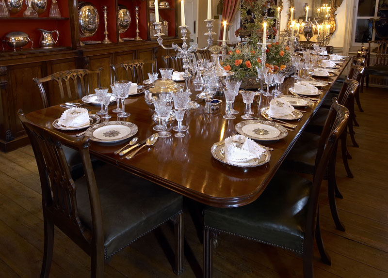 A mahogany triple pedestal dining table