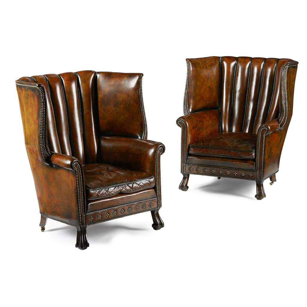 PAIR OF LEATHER UPHOLSTERED BARREL-BACK WING ARMCHAIRS