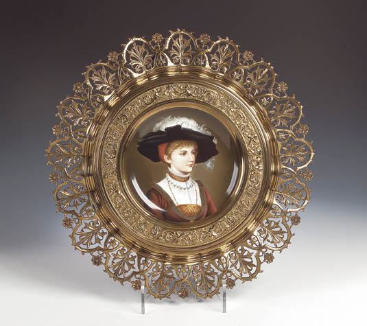 A pair of gilt brass framed circular Vienna style plates,