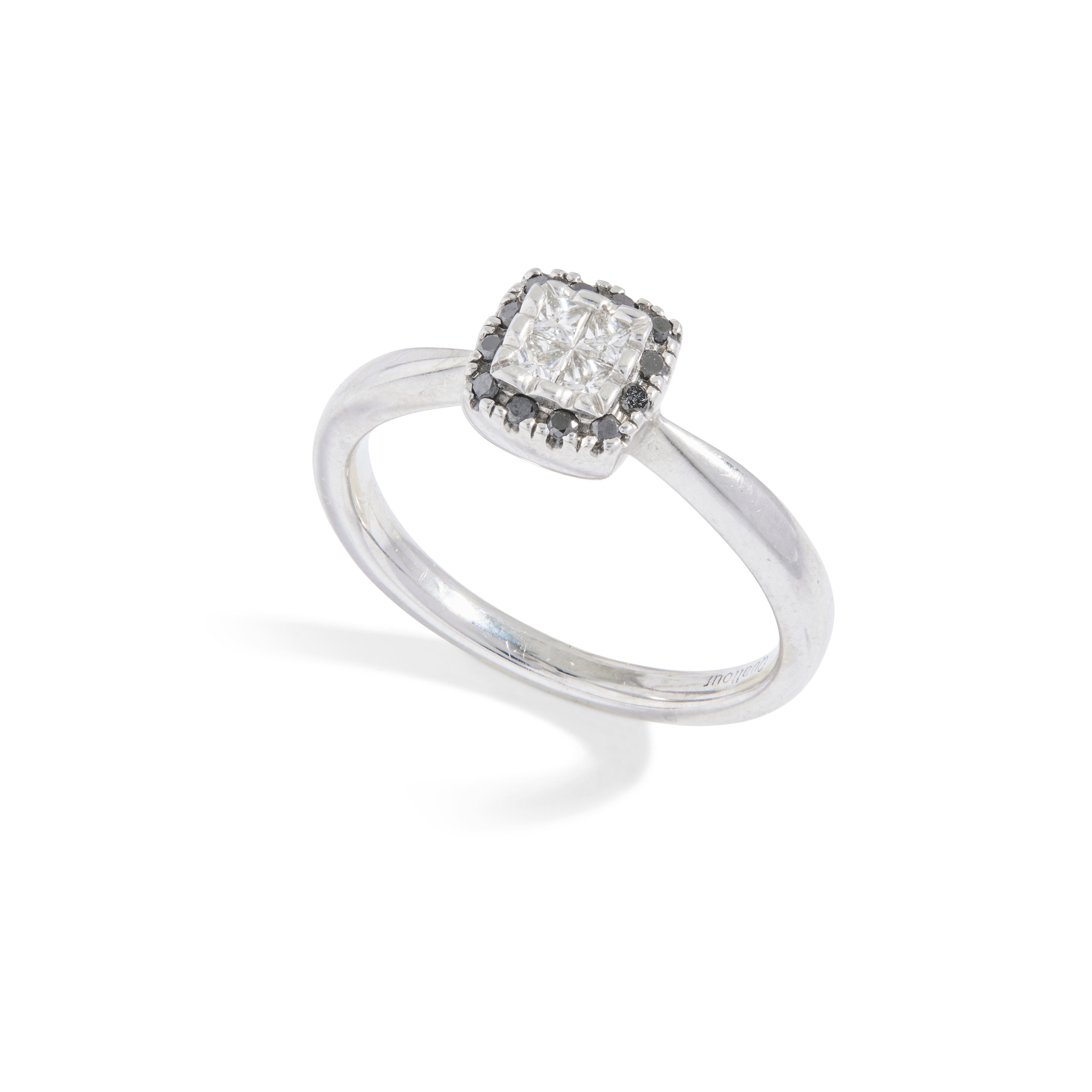 A black and colourless diamond cluster ring