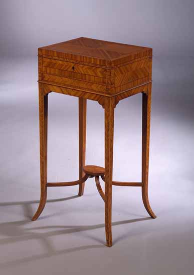 An Edwardian tulipwood lady's dressing chest on stand