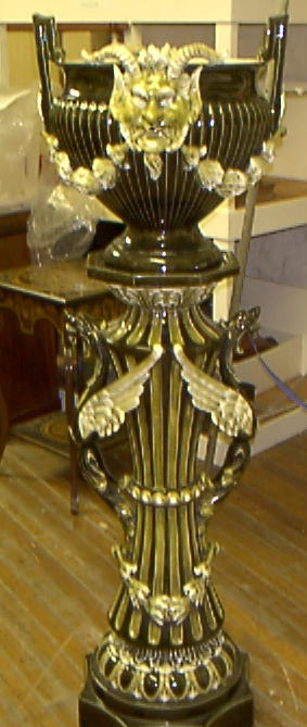 A monumental Continental faience jardiniere and stand