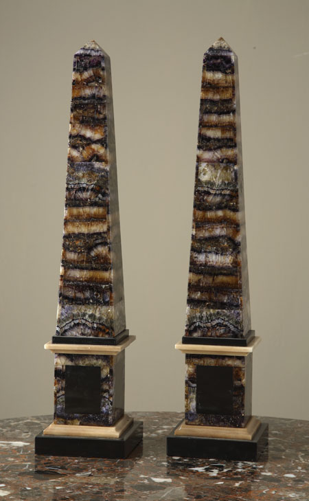 A pair of bluejohn and black marble obelisks