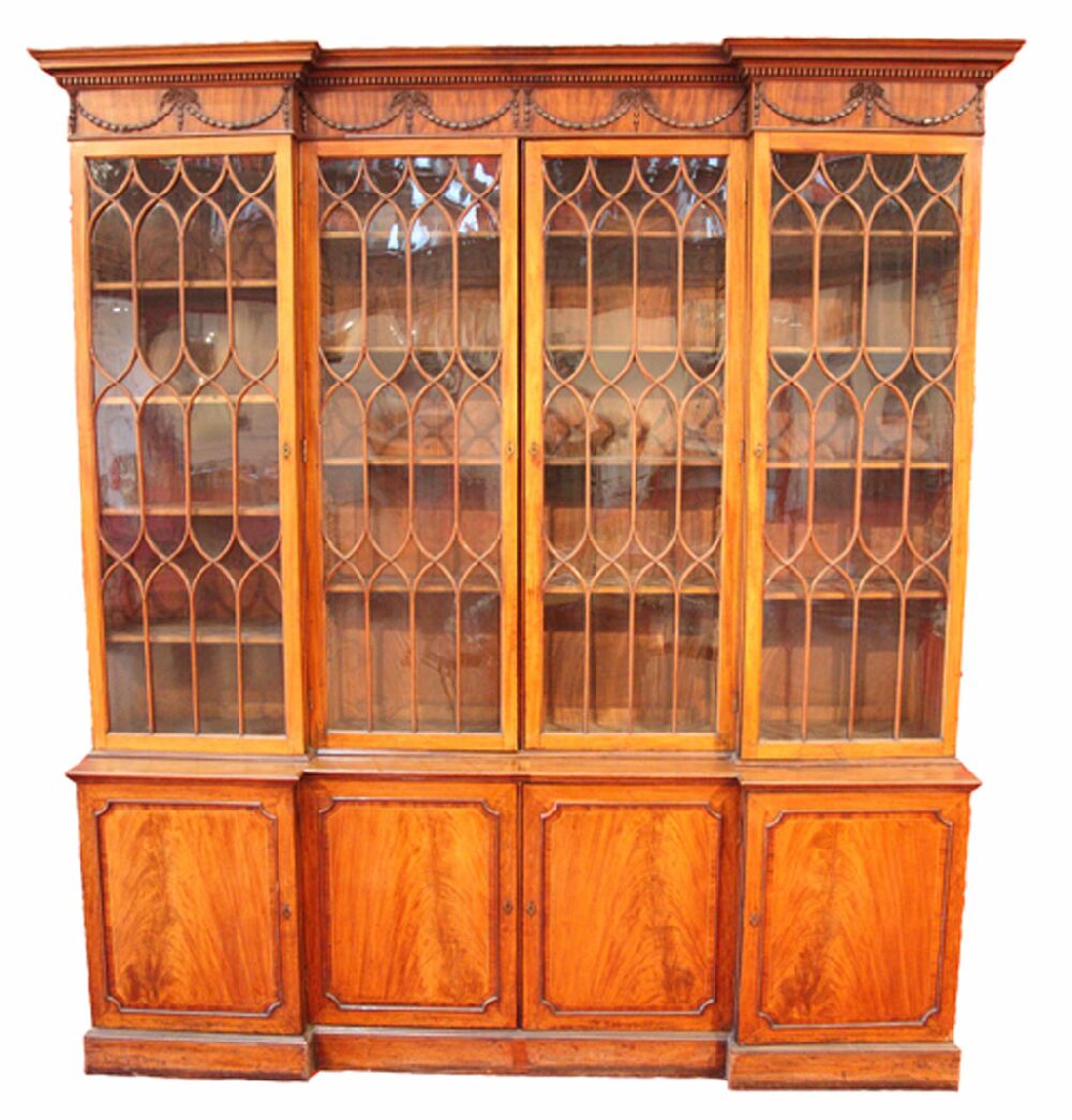 A George III mahogany inverted breakfront library bookcase