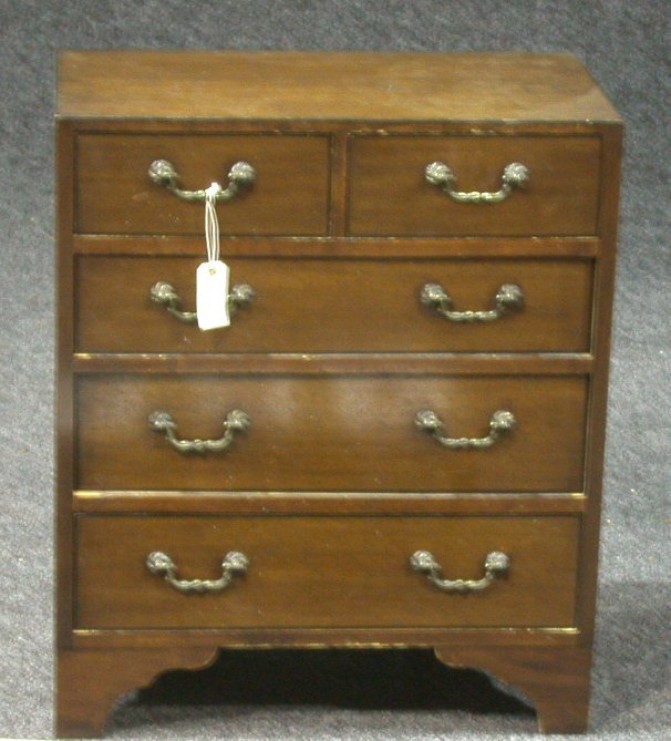 A small mahogany chest of drawers,