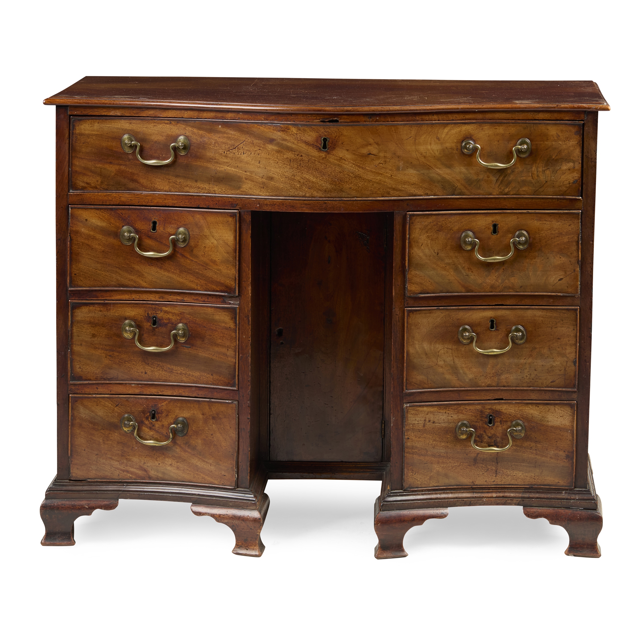 GEORGE III MAHOGANY SERPENTINE KNEEHOLE DESK
