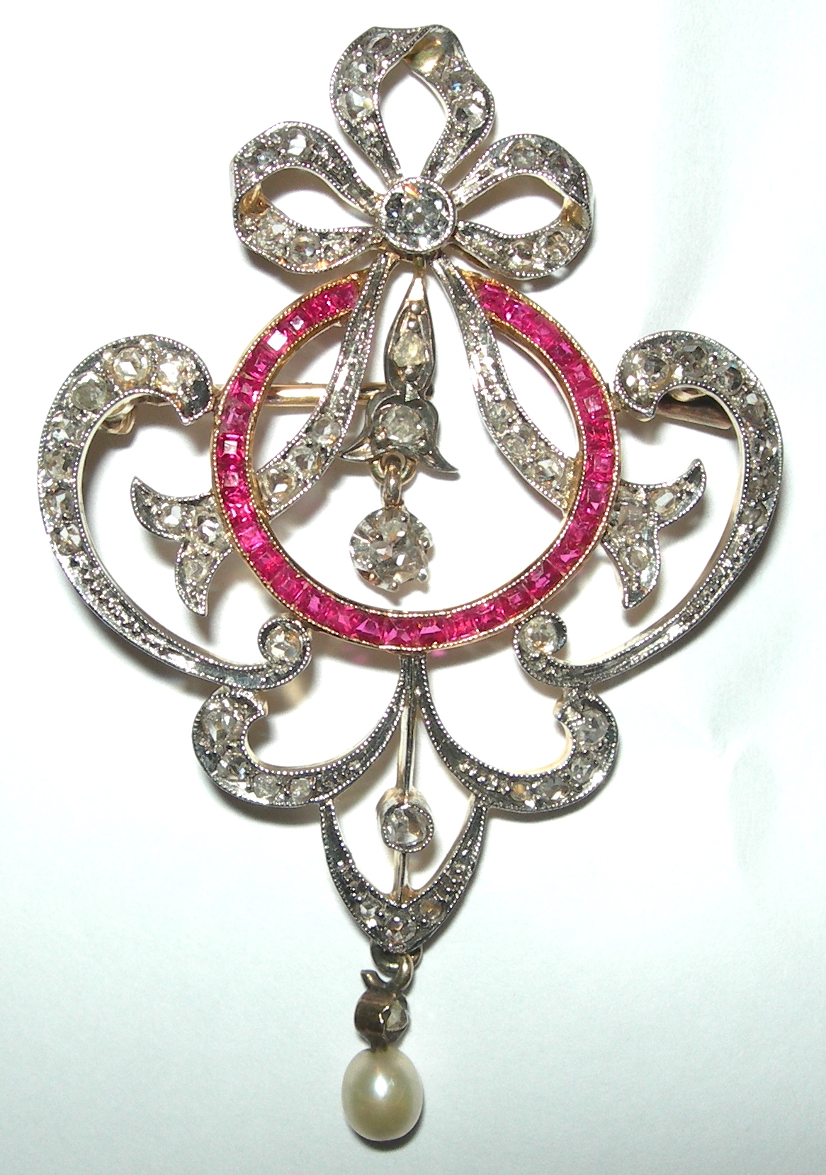 An early 20th century ruby and diamond set brooch,