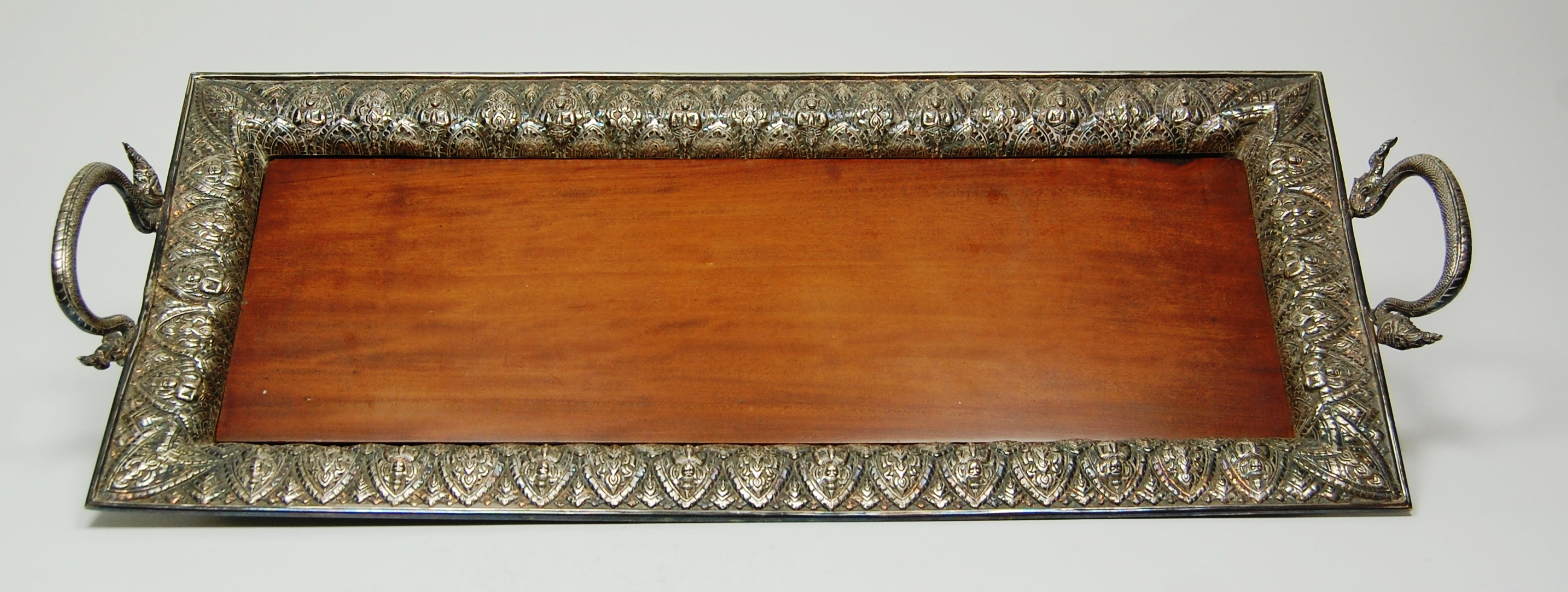 An Indian white metal drinks tray