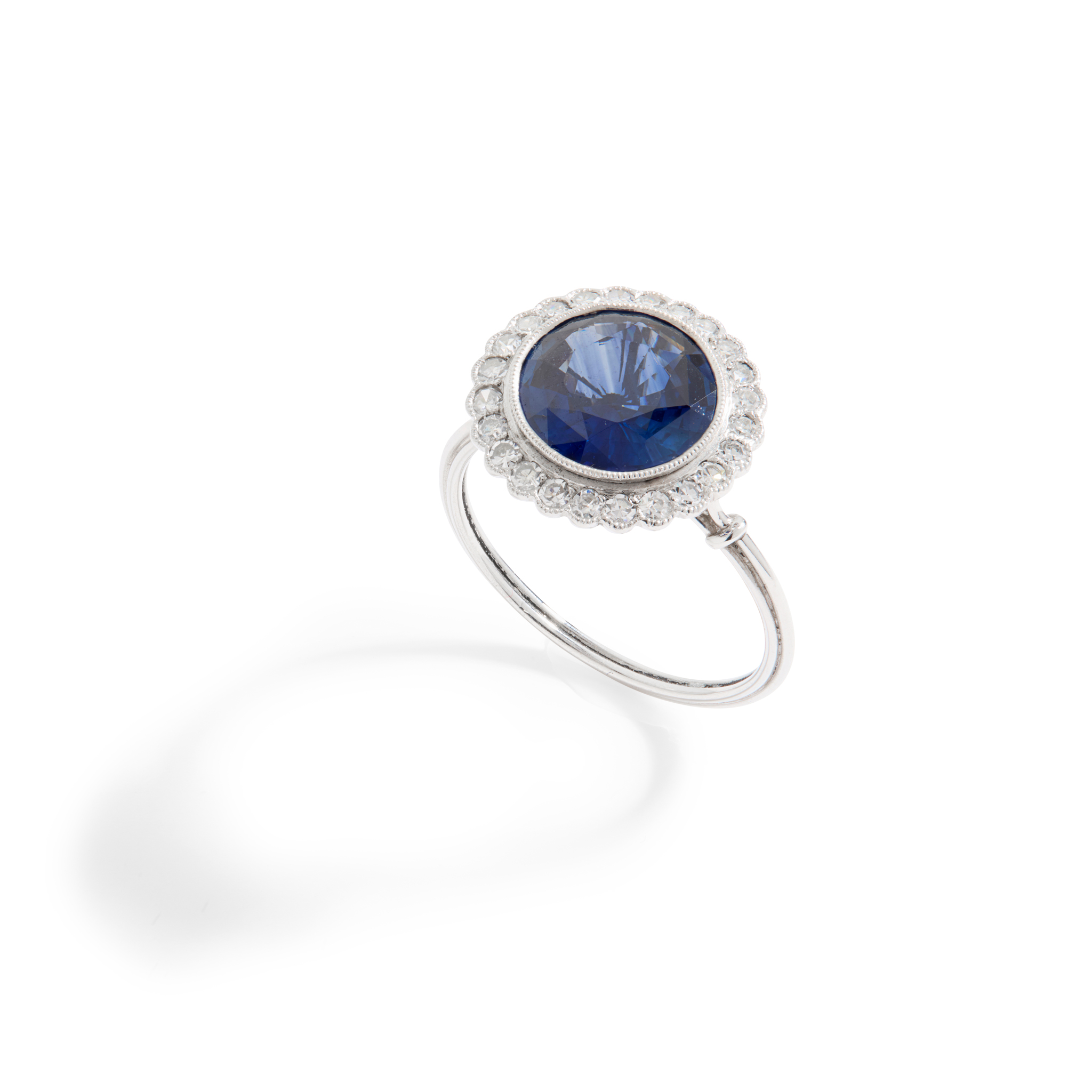 An early 20th century sapphire and diamond cluster ring, circa 1915