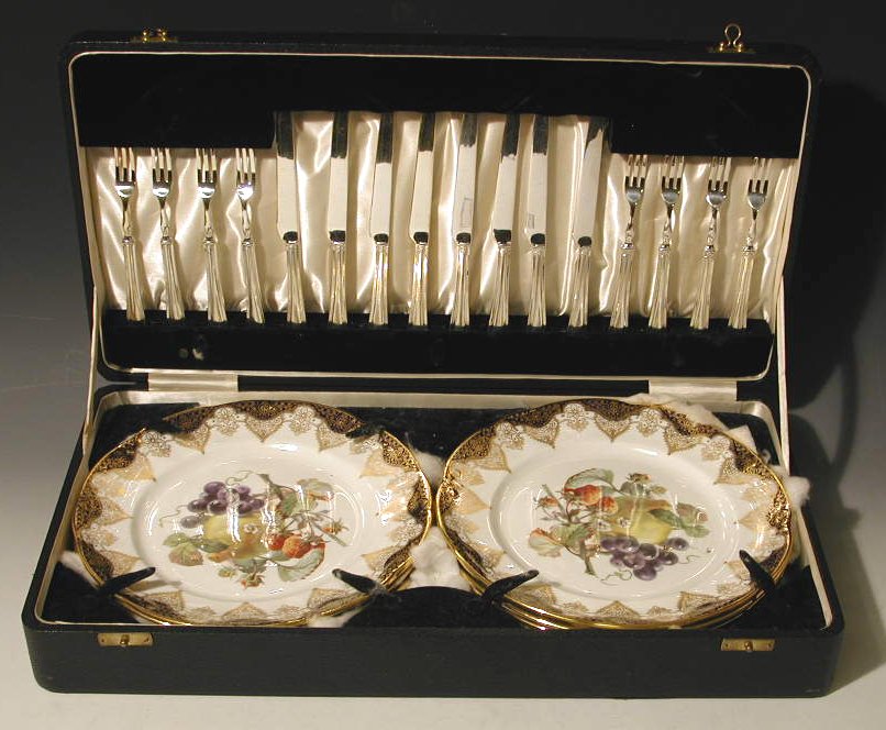 A cased twenty four piece dessert set