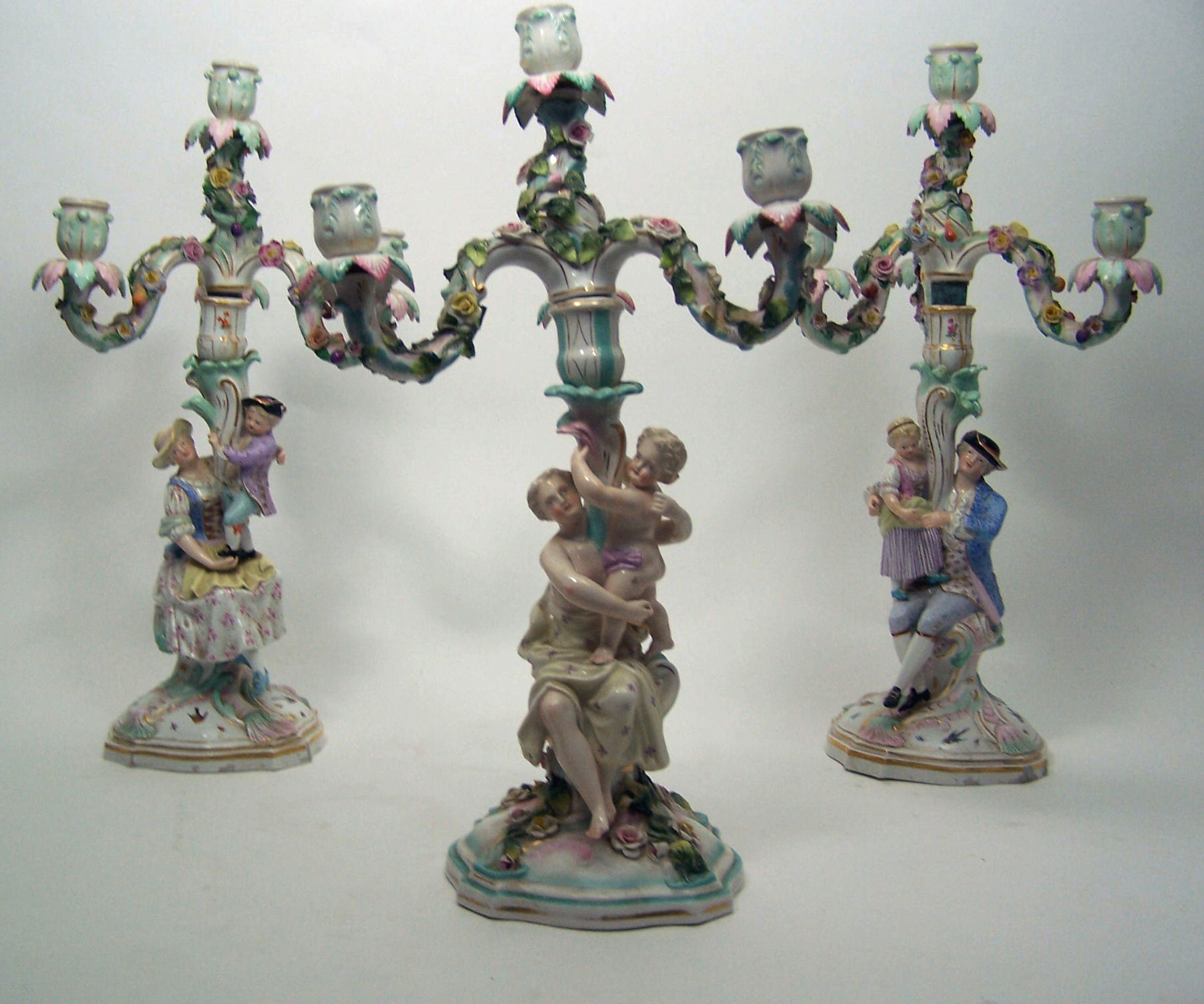 A pair of 19th century Meissen four light candelabra