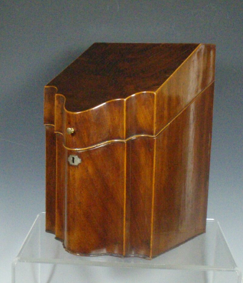 A George III serpentine mahogany knife box