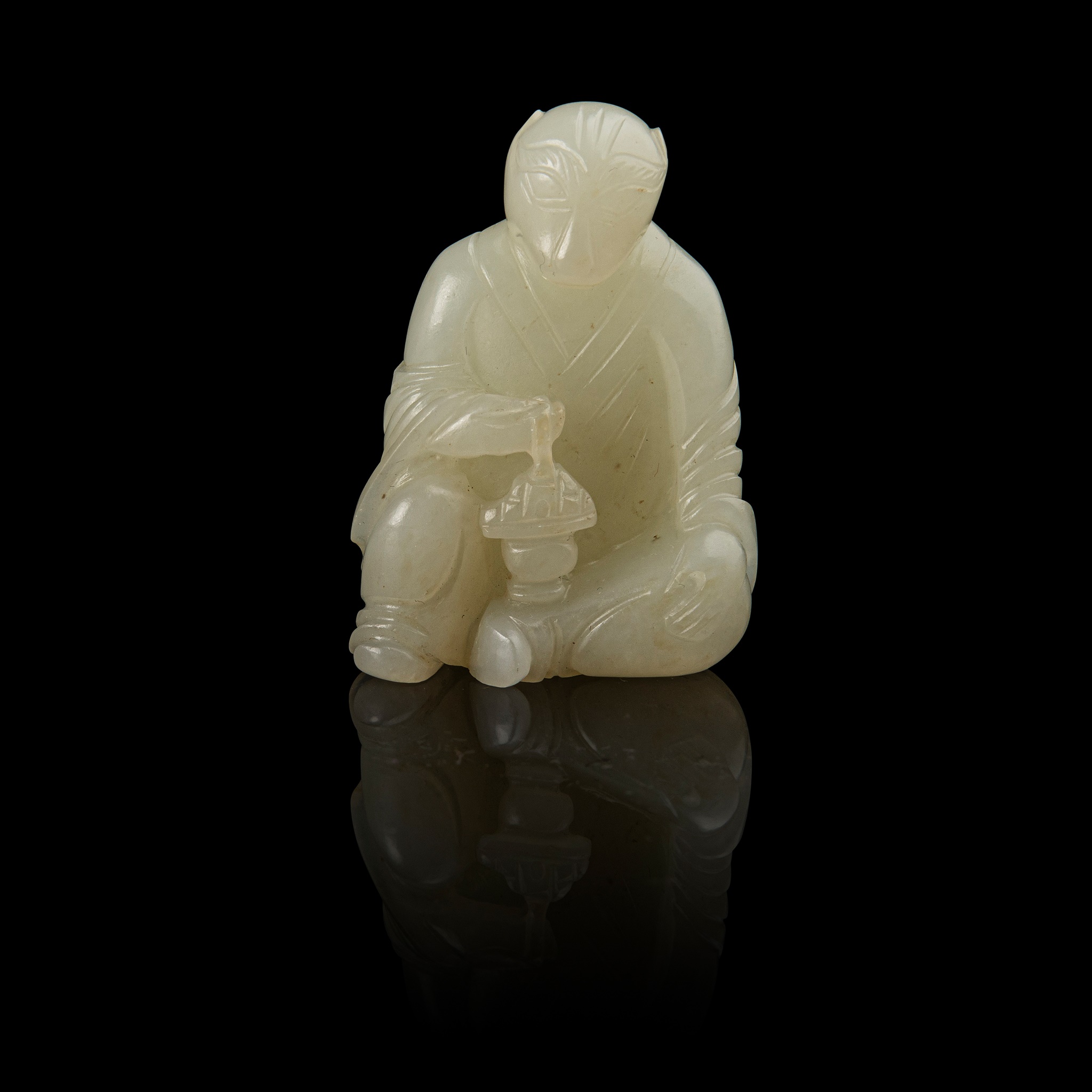WHITE JADE CARVING OF A TIGER DEITY