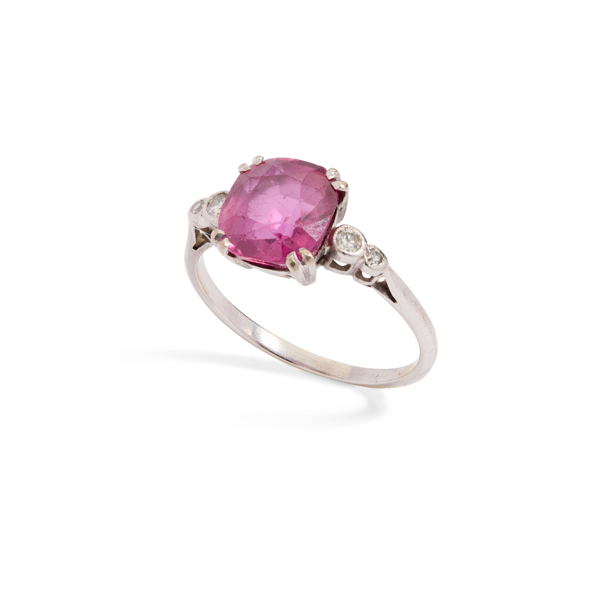 A pink sapphire and diamond ring