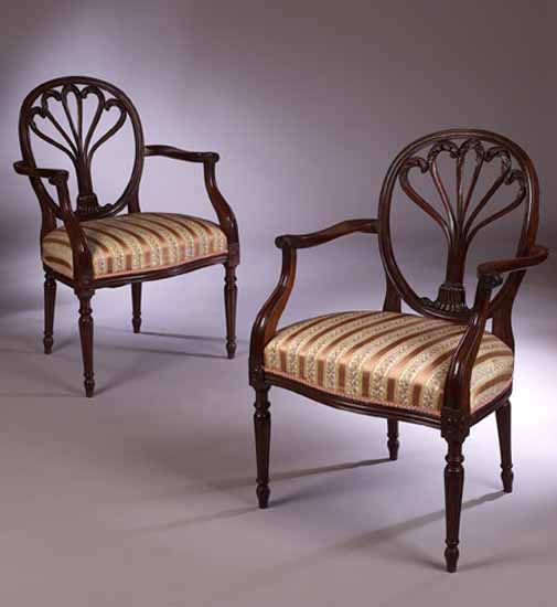 A set of ten George III style mahogany open armchairs