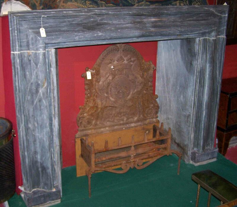 A 17th century bolection moulded grey marble fire surround