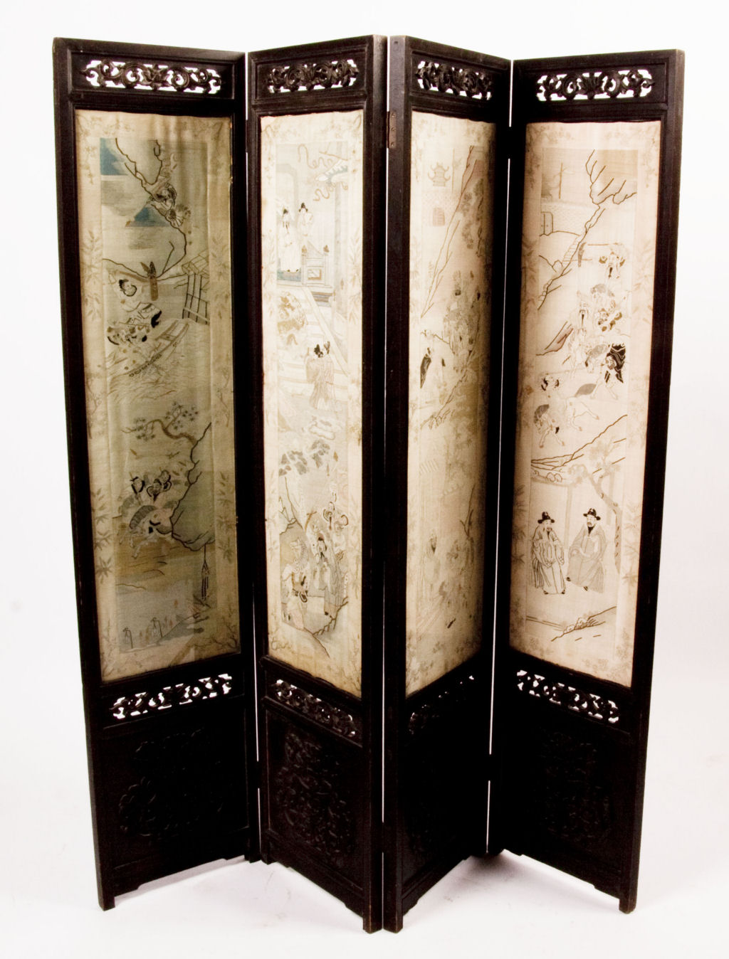 A late 19th century Chinese four fold screen with silk panels