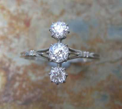 An early 20th century three-stone diamond ring,