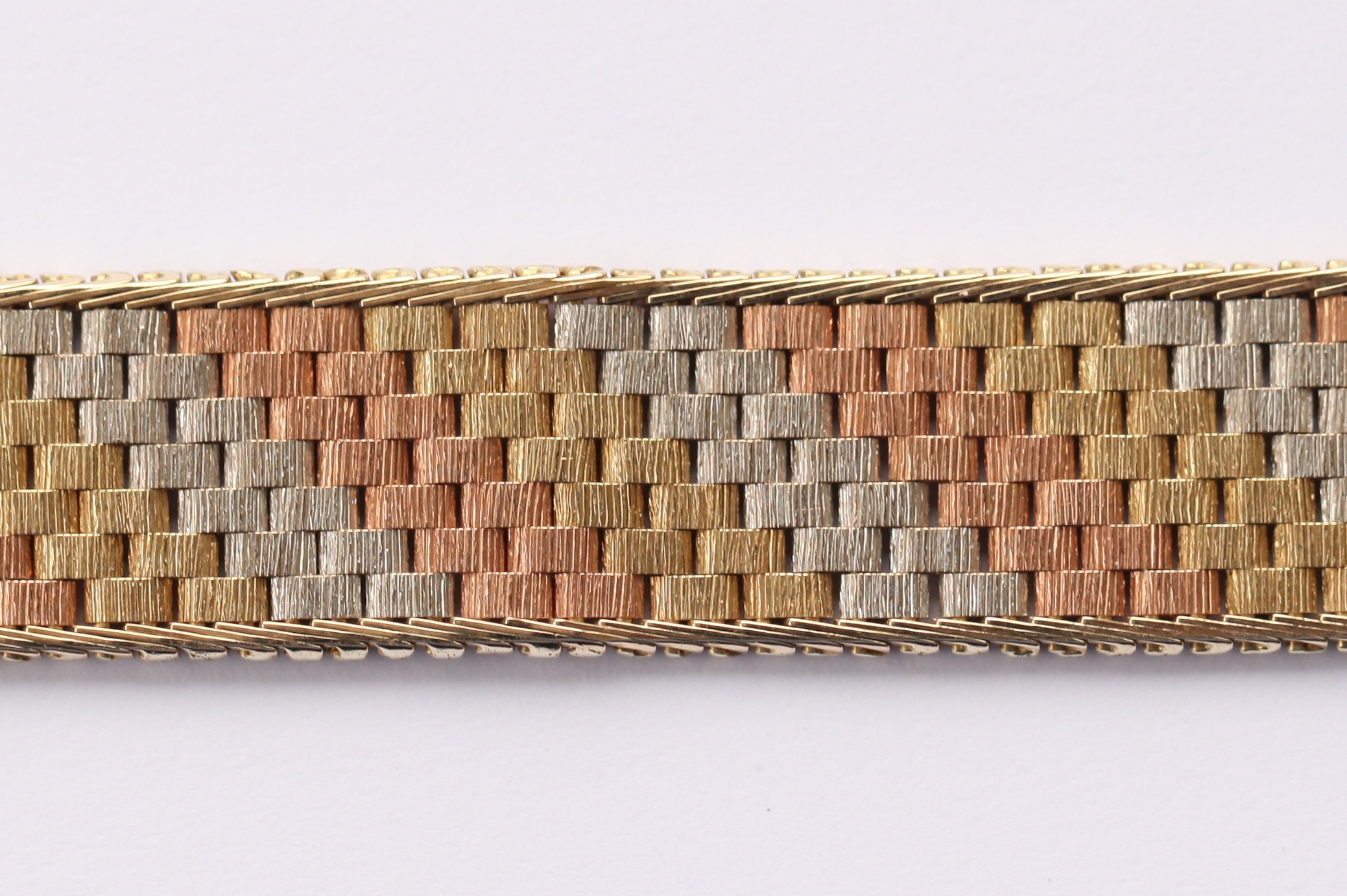 MAPPIN & WEBB - a 9ct three-coloured gold bracelet