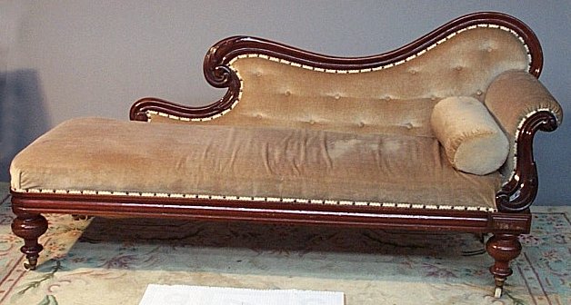 A Victorian mahogany framed scroll end settee