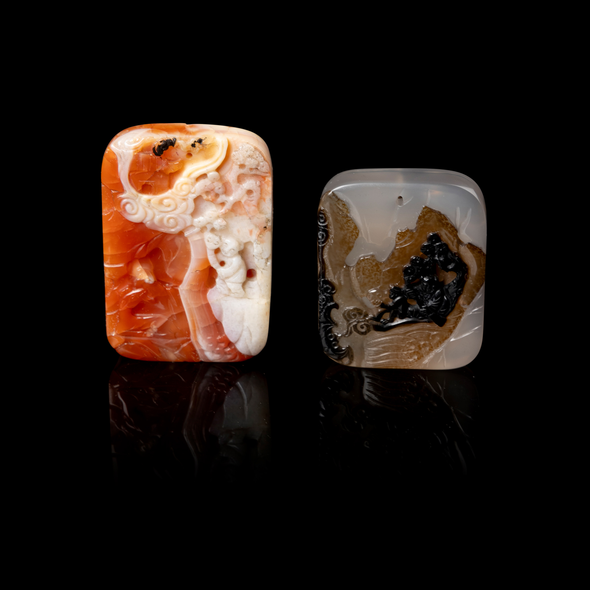 TWO CHINESE CARVED AGATE AND CARNELIAN RECTANGULAR PLAQUES