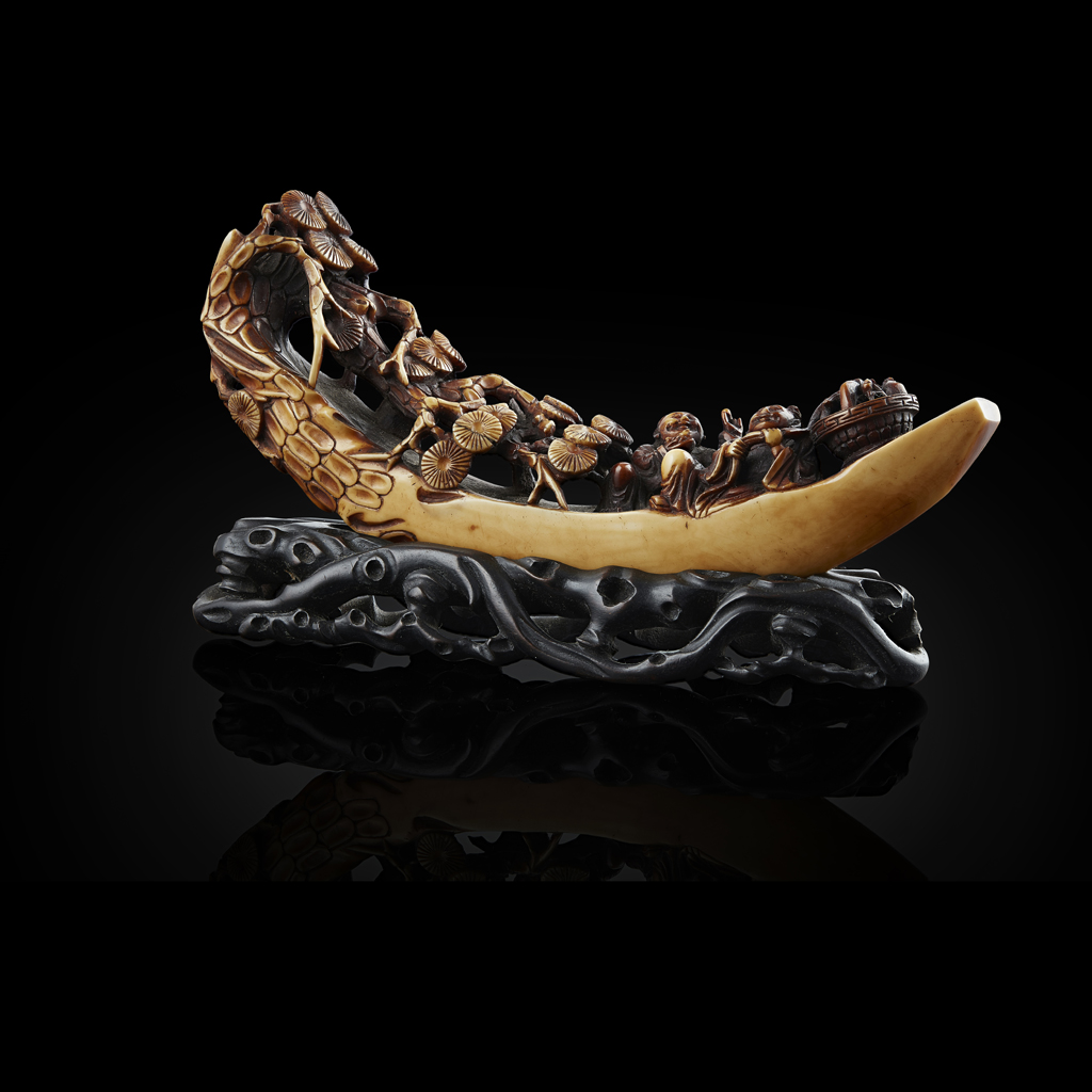 CARVED HIPPOPOTAMUS TOOTH MODEL OF A RAFT