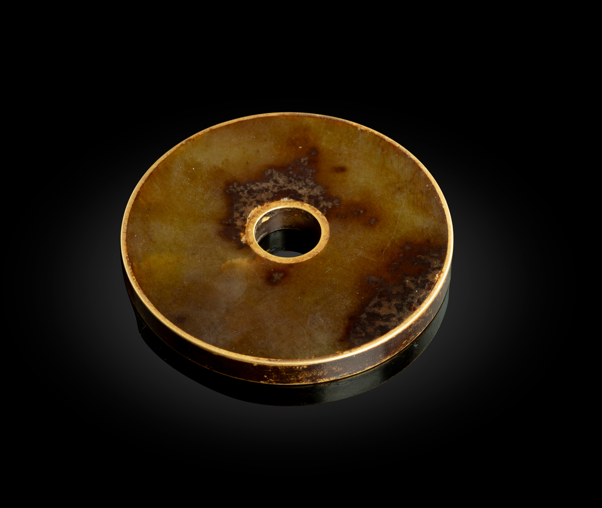 GILT-BRONZE-MOUNTED JADE CIRCULAR PENDANT