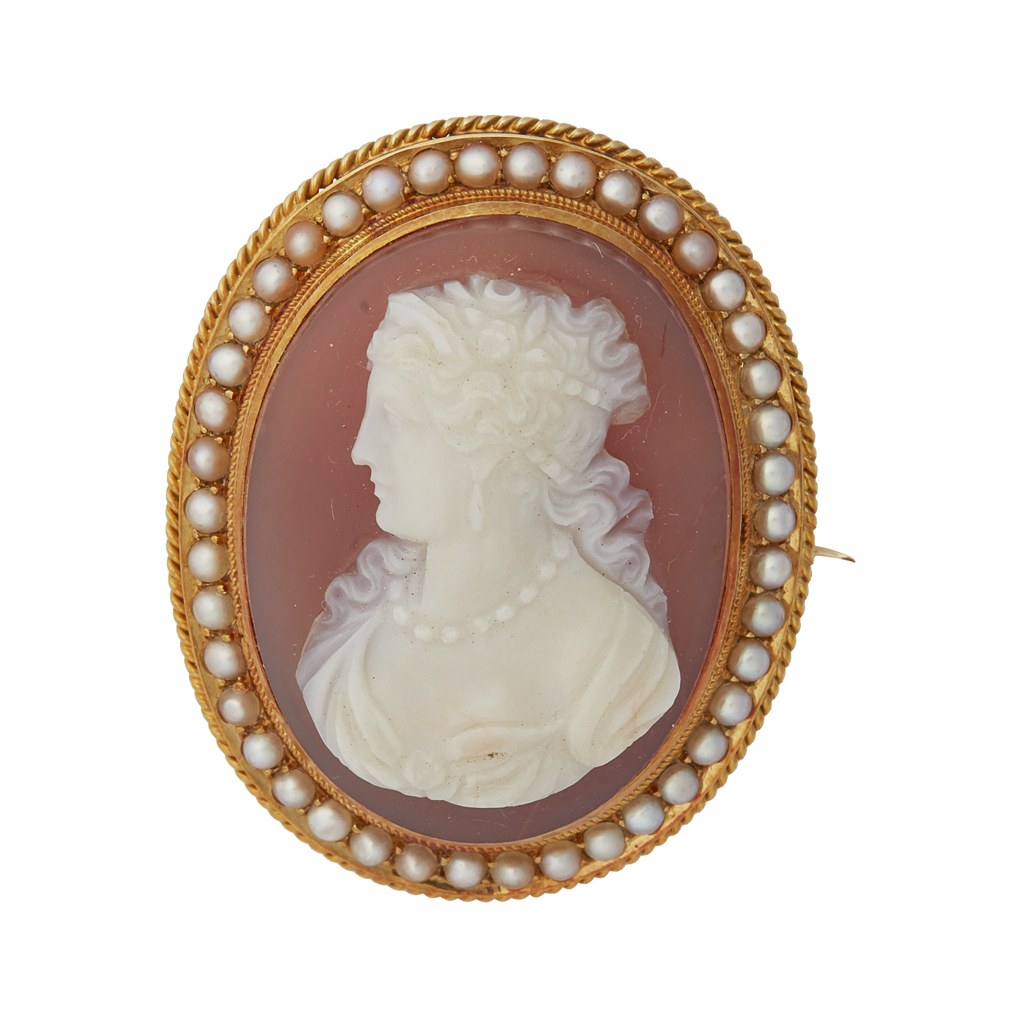 A hardstone cameo and pearl set brooch