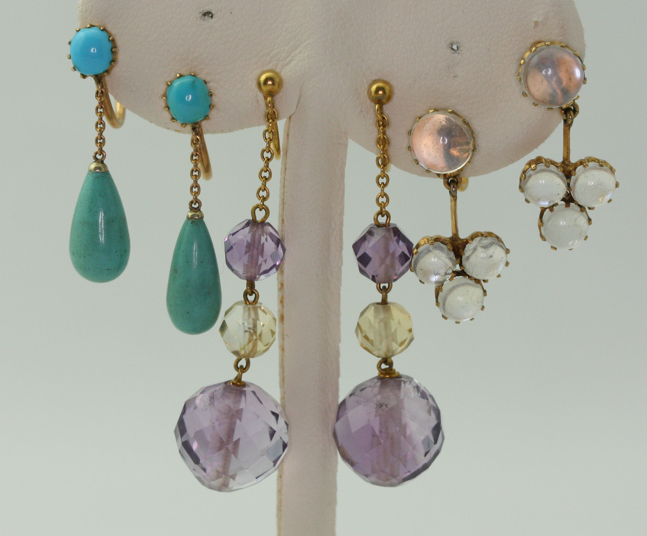 Four pairs of gem set pendant earrings