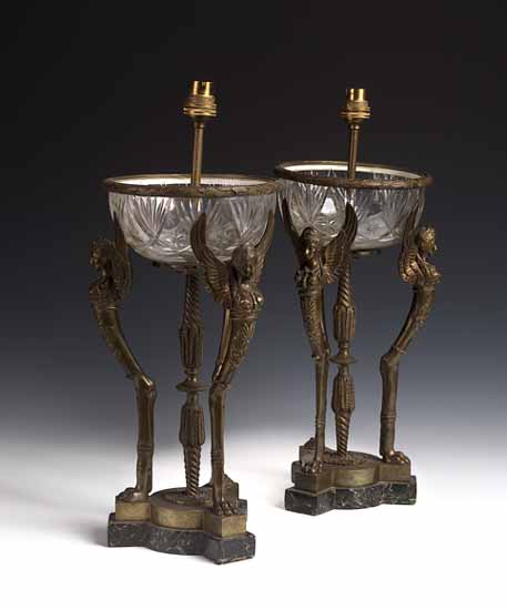 A pair of Empire style cut glass and bronze table lamps