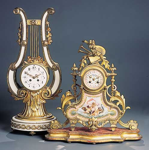 A French early 20th century gilt bronze and Carara marble mantel clock