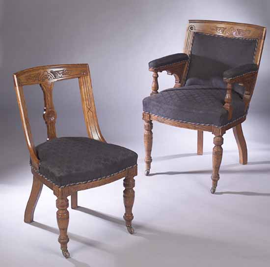 A set of twenty six Edwardian oak dining chairs