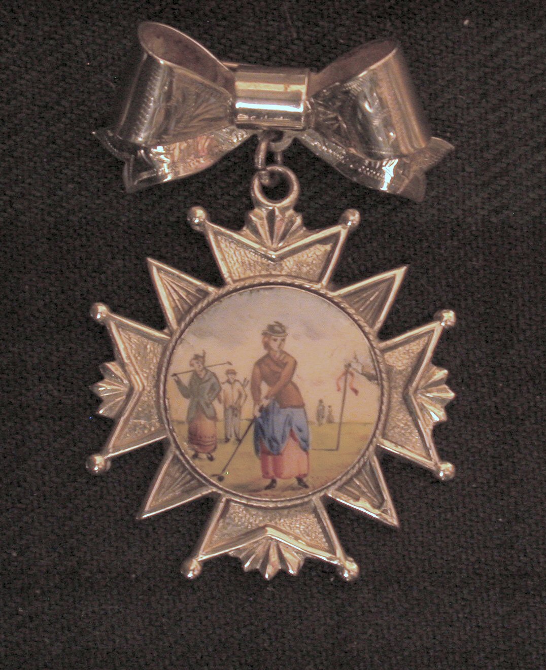 A silver and enamel lady's golfing medal,
