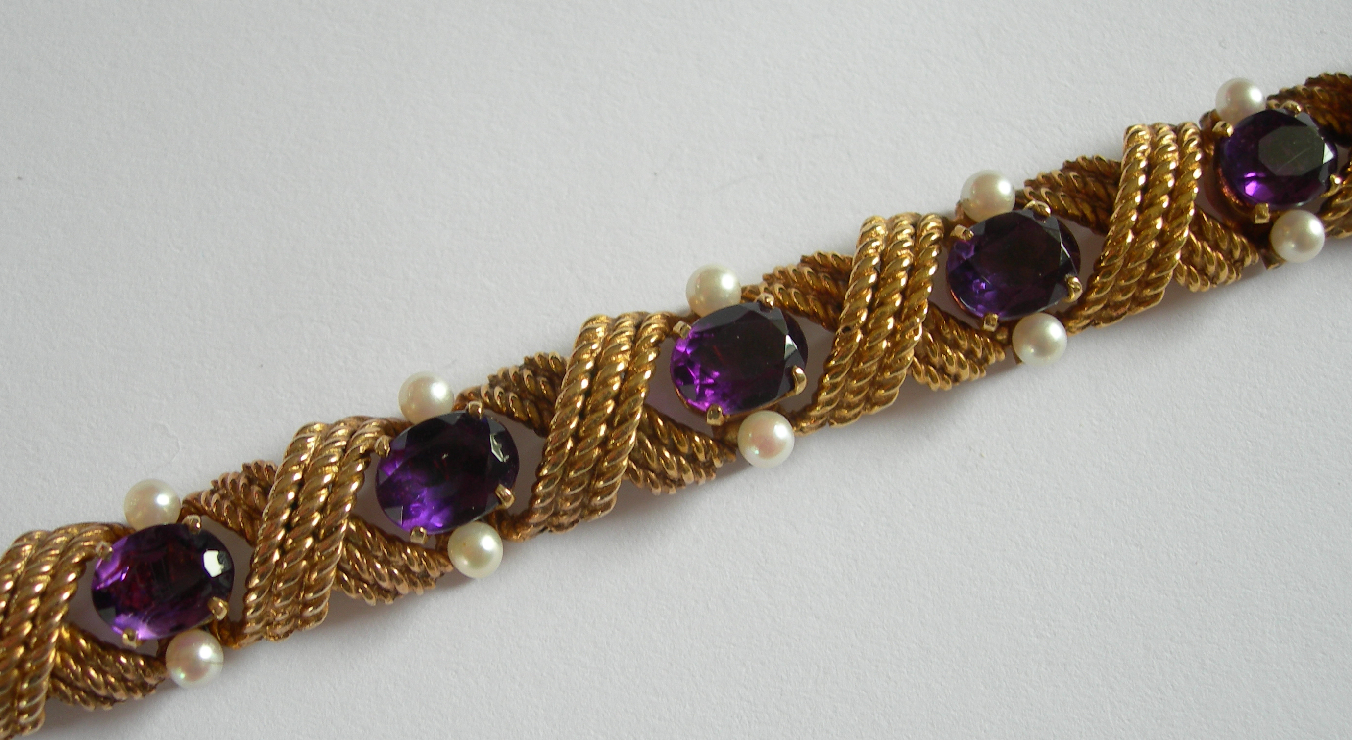 A mid-20th century 9ct gold bracelet,