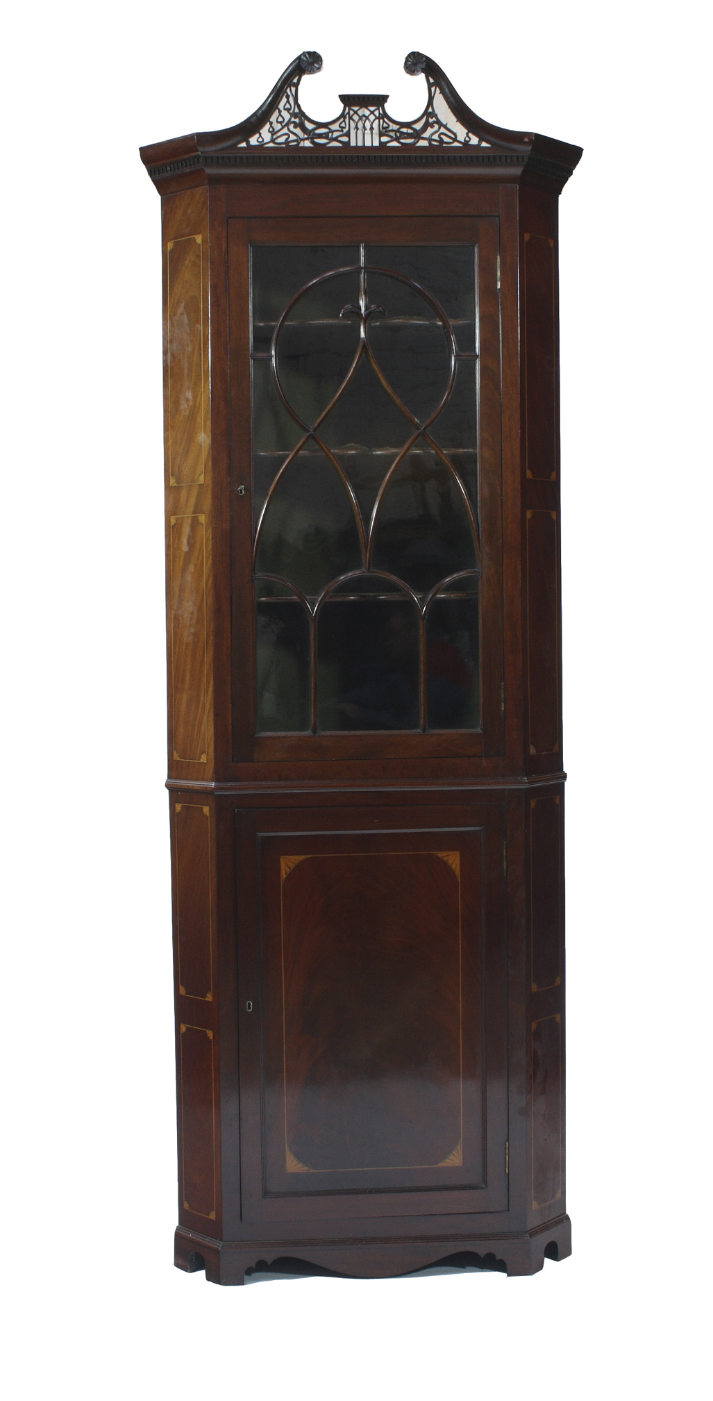 A Georgian mahogany corner cabinet