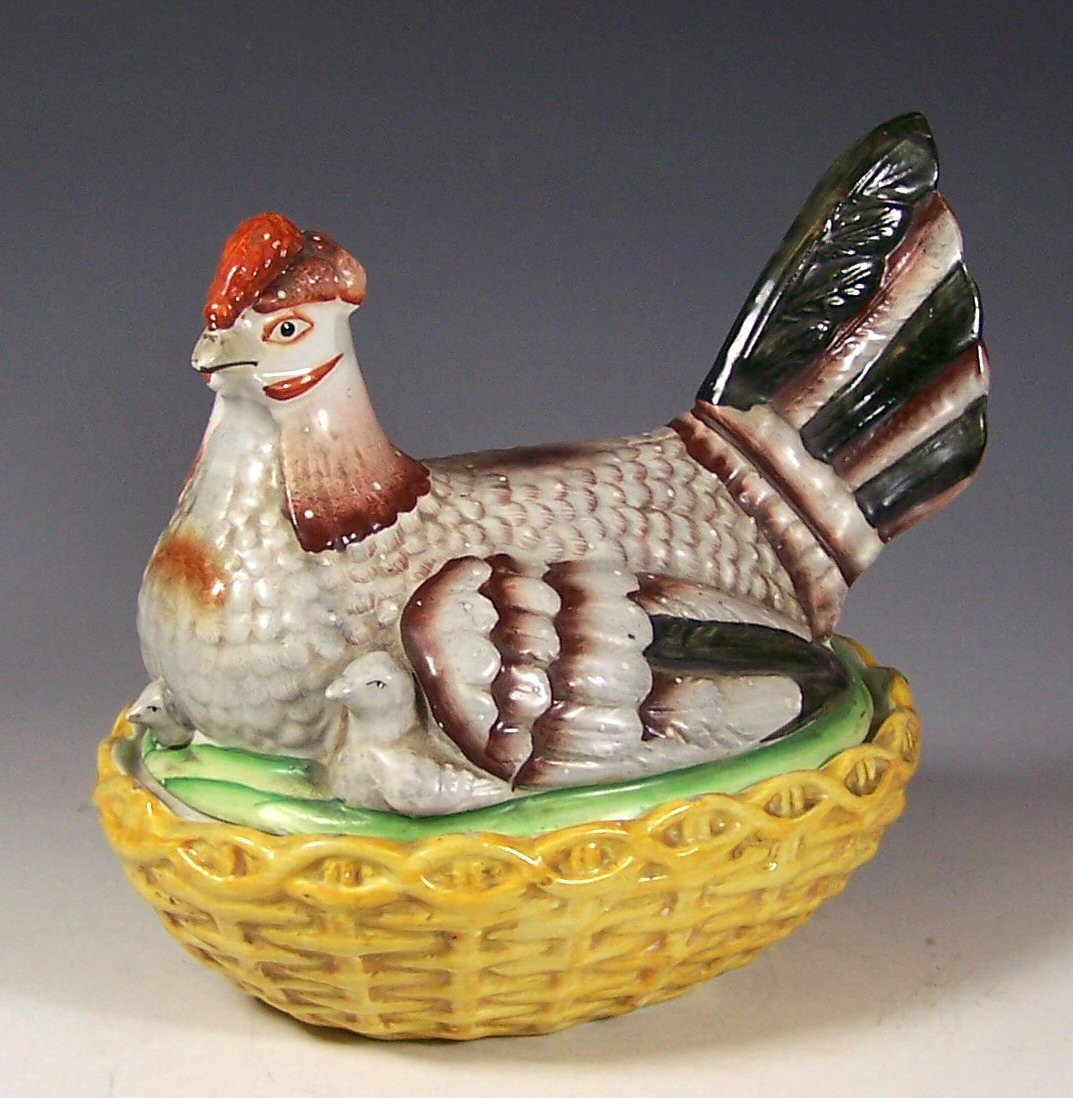 A 19th century Staffordshire hen and chick tureen and cover,